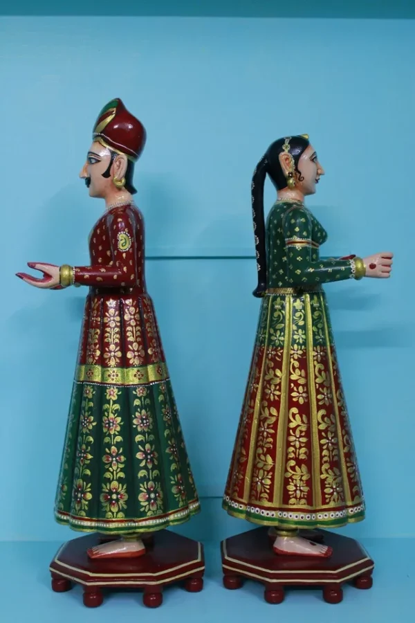 Beautifully carved painted couple of gangaur dolls made of wood, souvenir gift