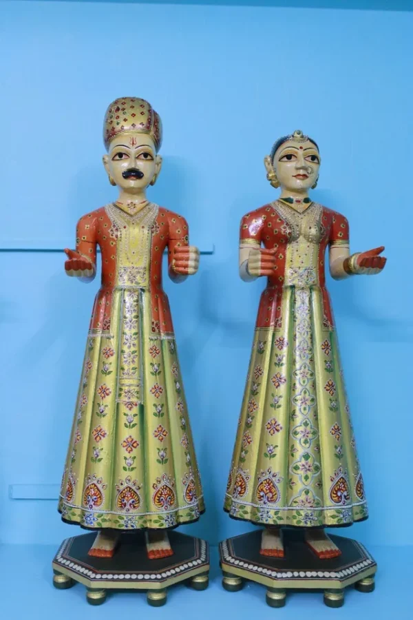 Beautifully carved painted couple of gangaur dolls made of wood, souvenir gift