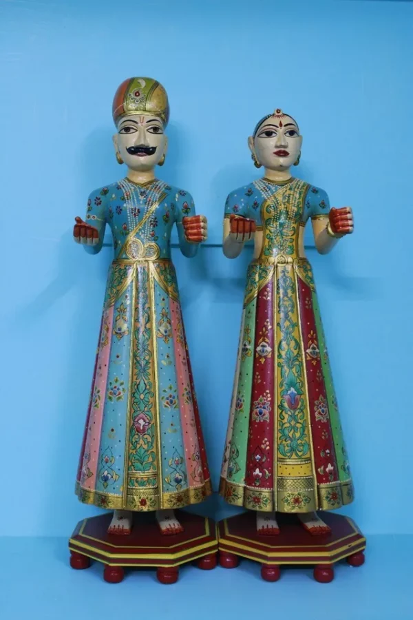 Beautifully carved painted couple of gangaur dolls made of wood, souvenir gift